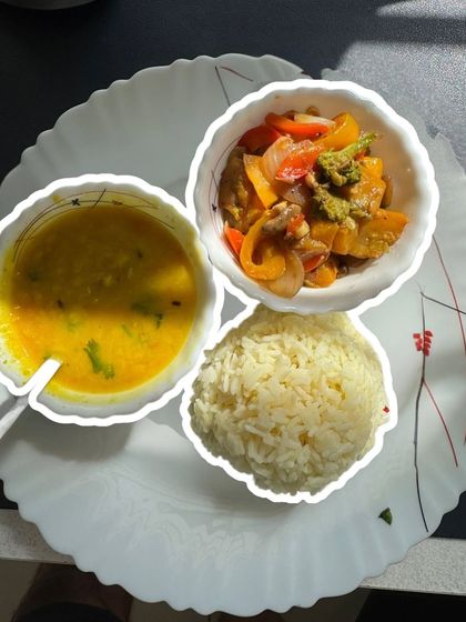 A classic Indian meal of dal, rice, and a colorful vegetable stir-fry. This is what real, healthy eating looks like.