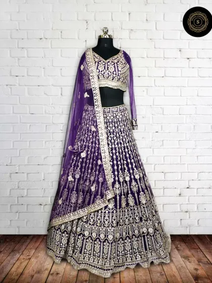 Another view of the purple lehenga on a mannequin, showcasing its full silhouette and intricate design.