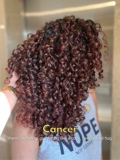 This deep-toned, nurturing color on curls is giving major Cancer zodiac energy. It's warm, comforting, and rich, like a cozy hug for your hair.