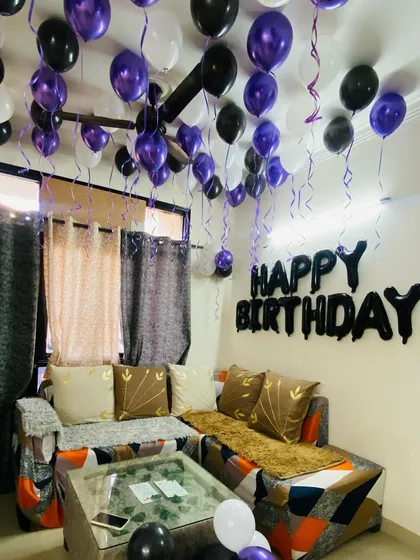 Another view of the simple living room birthday setup, showing how balloons can easily transform a space.