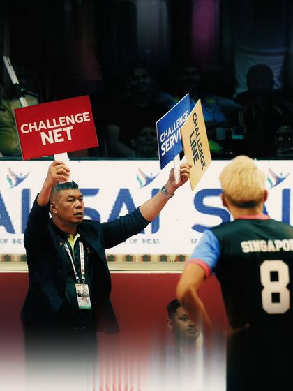 Even the officials are part of the action. This shot captures the intensity of a referee's call during a high-stakes moment in the Sepaktakraw World Cup.