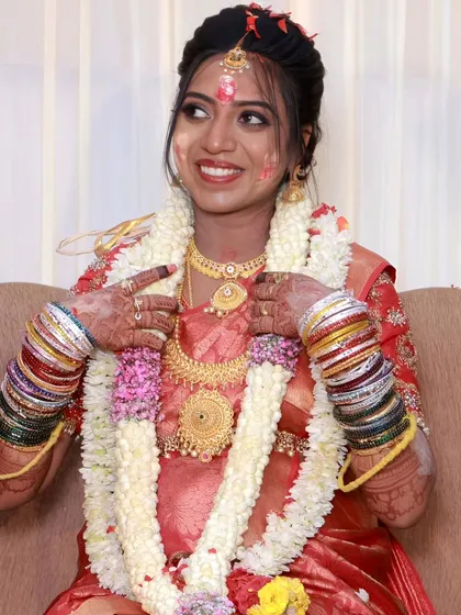 A joyful moment from a baby shower ceremony. The mom-to-be's makeup is fresh and vibrant, designed to last through all the rituals and celebrations.