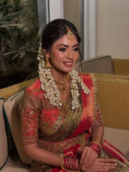 Here is a beautiful example of a traditional South Indian bridal look. I focused on creating a glowing, radiant base with soft, defined eyes, letting the intricate temple jewellery and the fresh flower veni in her hair complete this classic and elegant style.