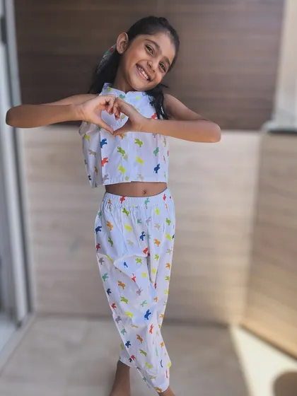 Roar! This colorful dinosaur print co-ord set is for the little girl with a big imagination. The comfy dhoti-style pants and crop top are perfect for hours of creative play.