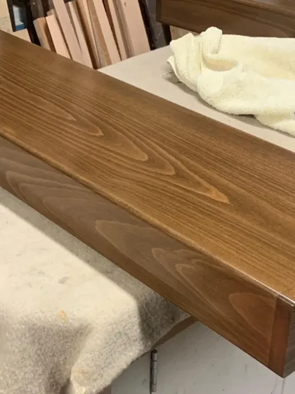 The rich color and grain of the solid oak used for the stair treads. I select high-quality hardwoods for both their durability and their appearance.