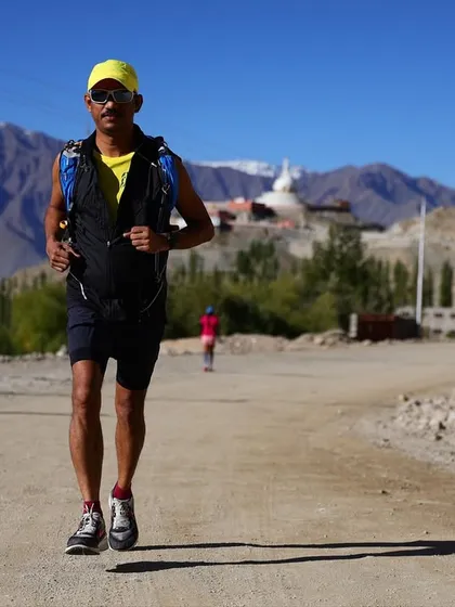 An athlete equipped with a hydration vest during a Ladakh training run, showcasing the importance of proper gear for high-altitude performance.