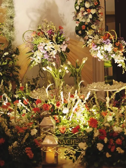 A floor-level view of the lush floral arrangements that surrounded the main stage.