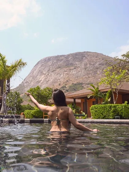 This is your moment to pause. Imagine yourself here, enveloped by the calm waters of our pool, with the majestic Nandi Hills standing guard. We have crafted this sanctuary for your ultimate relaxation and rejuvenation.