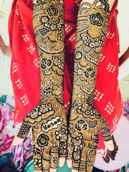 A personalized bridal design with the initials 'AH' and the name 'Hasan' beautifully incorporated.