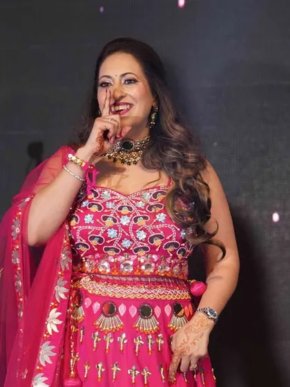 A candid shot of a performer enjoying her moment on stage. We focus on making everyone feel confident, so their happiness shines through in every step.