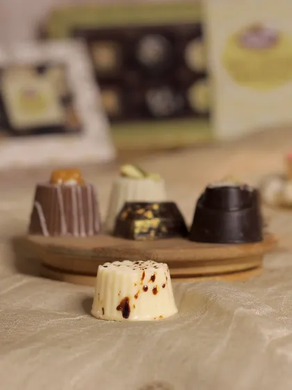 The Tiramisu soft-center chocolate, with its delicate white chocolate shell and coffee-dusted top.