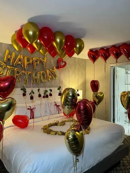 Another angle of the luxurious red and gold hotel room surprise.