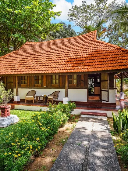 Welcome to Ambara Mana, a 73-year-old Kerala heritage cottage. We restructured this beautiful home in Bangalore to serve as a peaceful guest residence, complete with a garden bath and naturally cool interiors, even in summer.