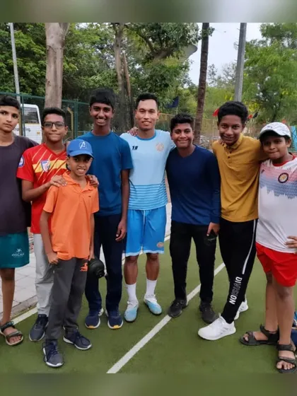 A group of our players with a professional footballer, gaining inspiration from those who have made it to the next level.