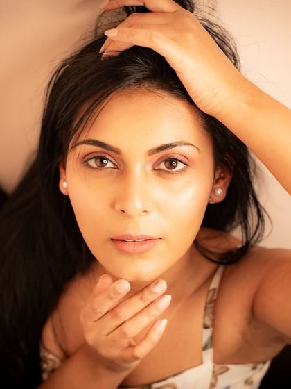 An intense close-up that draws the viewer in. This shot highlights expressive eyes and a strong presence.