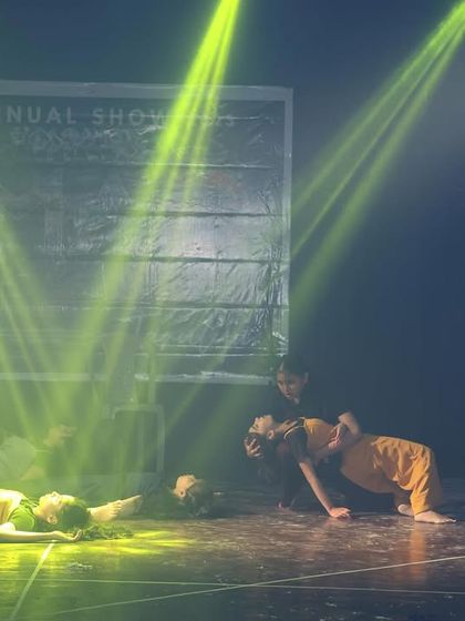 This scene uses dramatic, low lighting to create a somber and intimate mood, focusing the audience's attention on the emotional core of the story.