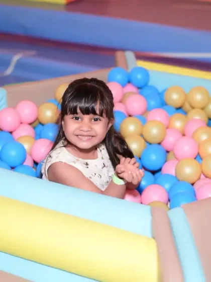 A happy smile from inside the ball pit. It’s a simple joy that brings out the biggest smiles from our little guests.