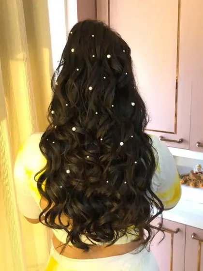Another angle of the pearl-adorned half-updo, showing how the pearls catch the light. It's a simple way to add a touch of elegance.