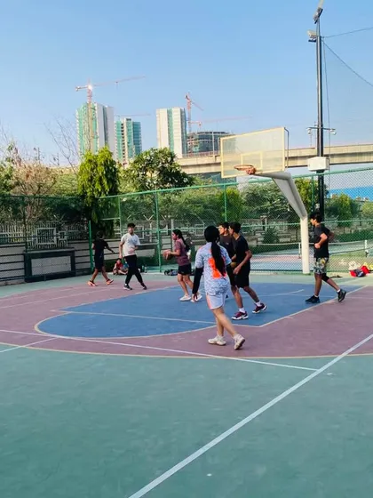 A view of the court during an evening game, with the city skyline in the background.
