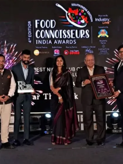 Our team proudly accepting the 'Best Nightclub of the Year' award on stage. This recognition is a result of their incredible dedication and passion.