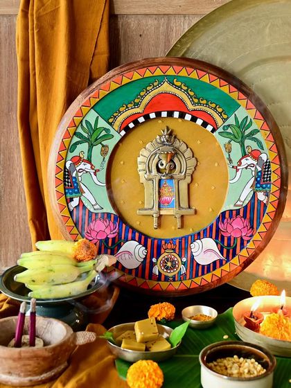 The Brihaspati frame, presented as a sacred offering. The golden-complexioned deity is surrounded by hand-painted motifs on a restored teak frame, creating a powerful homage to the great Guru.