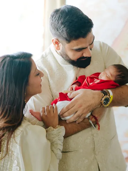 A new family begins. This lifestyle newborn session captures the awe and love of new parents.