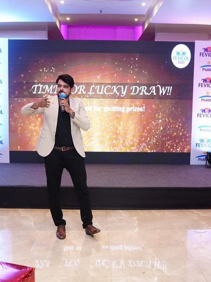 Announcing the lucky draw segment during the Fevicol event. I can seamlessly transition from formal presentations to more exciting segments like prize distributions, keeping the momentum going.