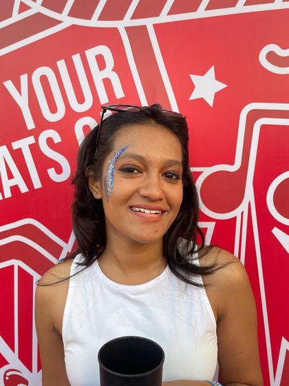 Another shot of the smiling client and her blue glitter art. It's all about creating looks that make people happy.