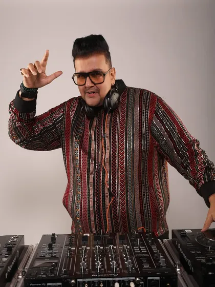 Another look from my professional shoot. This pose captures the energy and confidence I feel when I'm behind the console, ready to command a crowd.