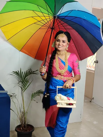 A playful and happy shot of the Madisar drape. It shows that even the most traditional styles can be worn with a sense of fun and personality.