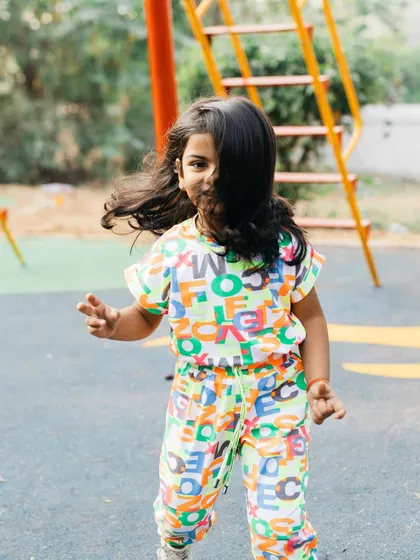 Her hair flying across her face as she runs. This is the wild child moment I love, capturing her spirit and the joy she finds in simple play.
