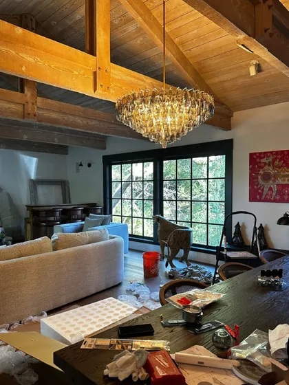 There's a moment in every project when the vision starts to become real. Here, we are unboxing and setting up the chandelier in the Saratoga home. It's a messy, exciting process, but seeing the space transform piece by piece is what we live for.