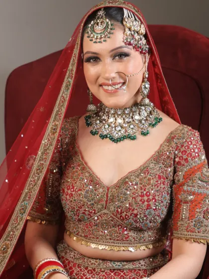 A happy bride smiling brightly in her full bridal attire. This image captures the joy and confidence that comes with feeling your best on your wedding day.