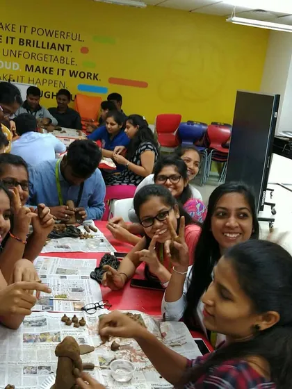 The smiles and laughter say it all. A corporate Ganesha-making workshop is a fantastic way for teams to relax, bond, and engage in a creative, hands-on activity.
