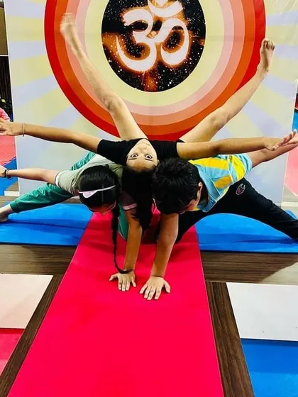 Another wonderful group pose from our kids' yoga session. These activities help develop communication and cooperation skills alongside physical strength.