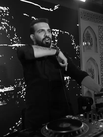 In my zone, chasing that perfect drop. These black and white shots capture the focus and joy I find in creating the perfect party atmosphere.