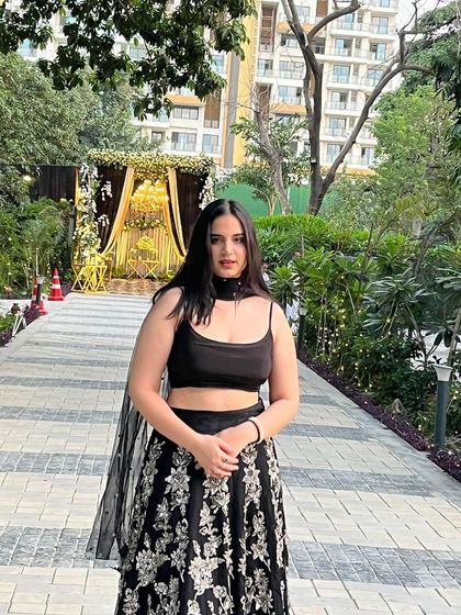 This black embroidered lehenga shows how a simple change can create a new look. Here, it's styled with a simple black crop top for a modern, minimalist feel.