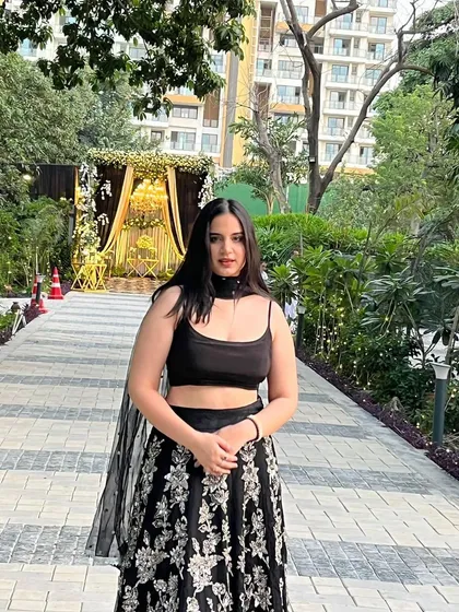 This black embroidered lehenga shows how a simple change can create a new look. Here, it's styled with a simple black crop top for a modern, minimalist feel.