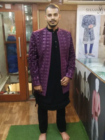 We create outfits in a wide range of colors to suit your style. This client chose a bold purple Jodhpuri jacket with a rich texture, worn over a classic black kurta set for a striking, high-contrast look.