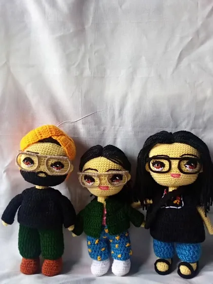 I love creating entire family sets. Here is a custom crochet family portrait, with each member designed based on photos to capture their individual look and style.