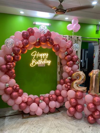 Here I've added '21' foil balloons to the pink and rose gold backdrop to celebrate a milestone birthday.
