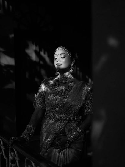 A dramatic black and white portrait of a bride, the light and shadows creating a timeless and artistic image.