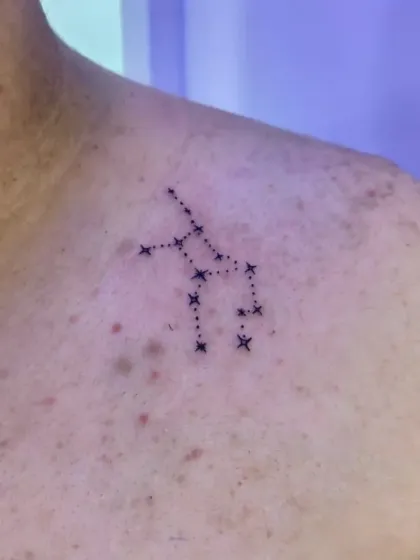 A constellation tattoo on the shoulder. We carefully map out the stars to ensure accuracy for the specific zodiac sign or celestial pattern the client wants.