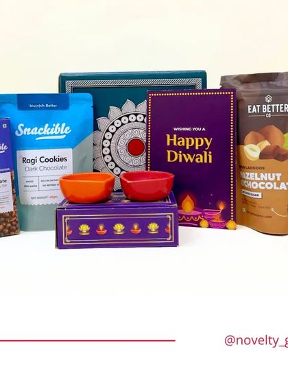 A delightful and budget-friendly Diwali hamper. This set includes a designer box, healthy snacks like ragi cookies and hazelnut chocolate, a Diwali card, and two small bowls for serving, starting from just Rs.399.