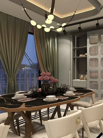 This dining area in our Hemkunt, Delhi project was designed for sophisticated entertaining. The unique leaf-shaped dining table with a black marble top, elegant upholstered chairs, and a modern chandelier come together to create a space that is both luxurious and inviting.