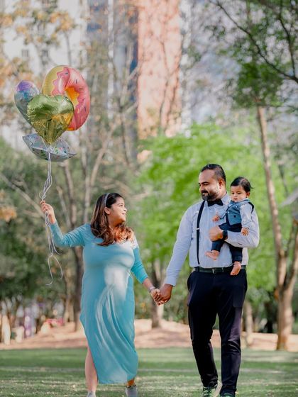 A duplicate of image 22, showing a slightly different moment in the family's walk, capturing their relaxed interaction.