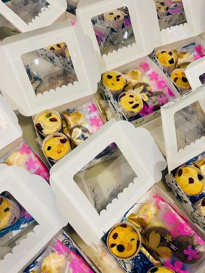 Simple and elegant window boxes filled with assorted treats. These are a great option for budget-friendly return favors that still feel special.