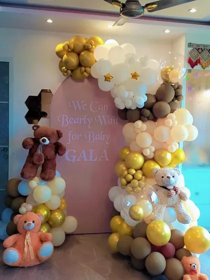 Welcome the little one with our adorable "We Can Bearly Wait" baby shower theme. This setup combines a custom pink backdrop with an organic balloon arch in pastel, brown, and gold tones, complete with cute teddy bear props for a heartwarming celebration.