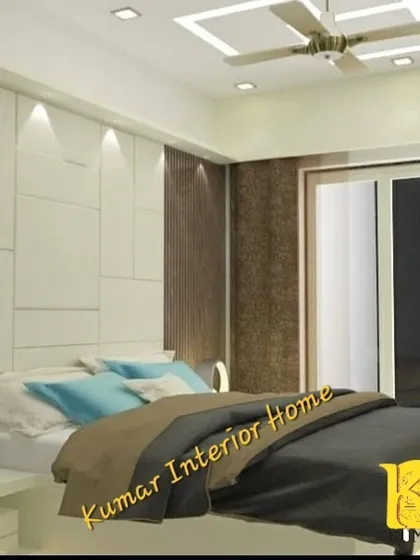 A different angle of the bedroom, showing the textured wallpaper and the simple yet elegant bed design.