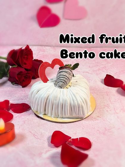 A little bit of everything you love. The Mixed Fruit Bento Cake is a light, heart-shaped cake topped with fresh, juicy fruits and a chocolate-dipped strawberry.